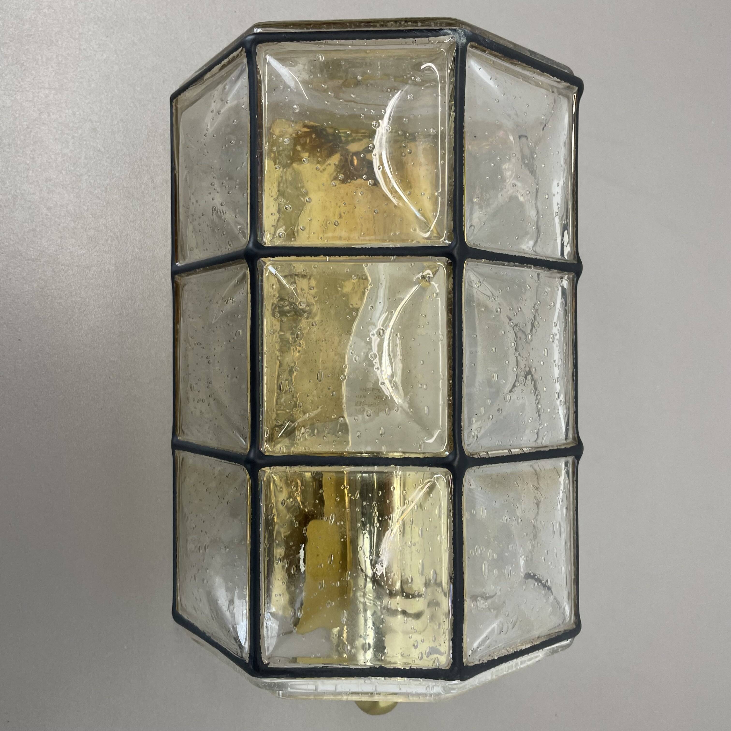 Wall light "Iron Rings" in brass and glass by Glashütte Limburg, Germany, 1970s