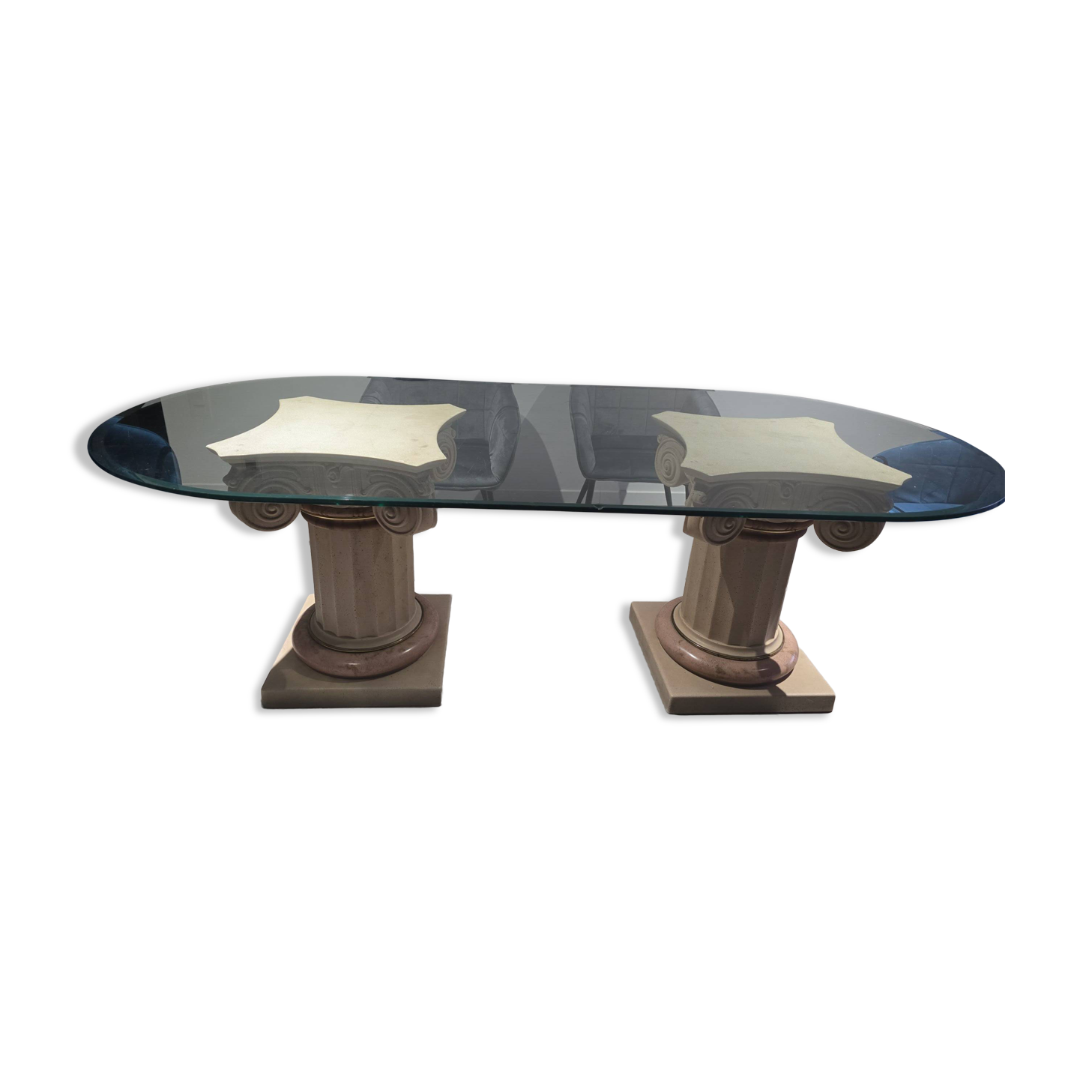 Oval glass table with marble column.