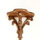Golden wood wall console in Louis XV style.