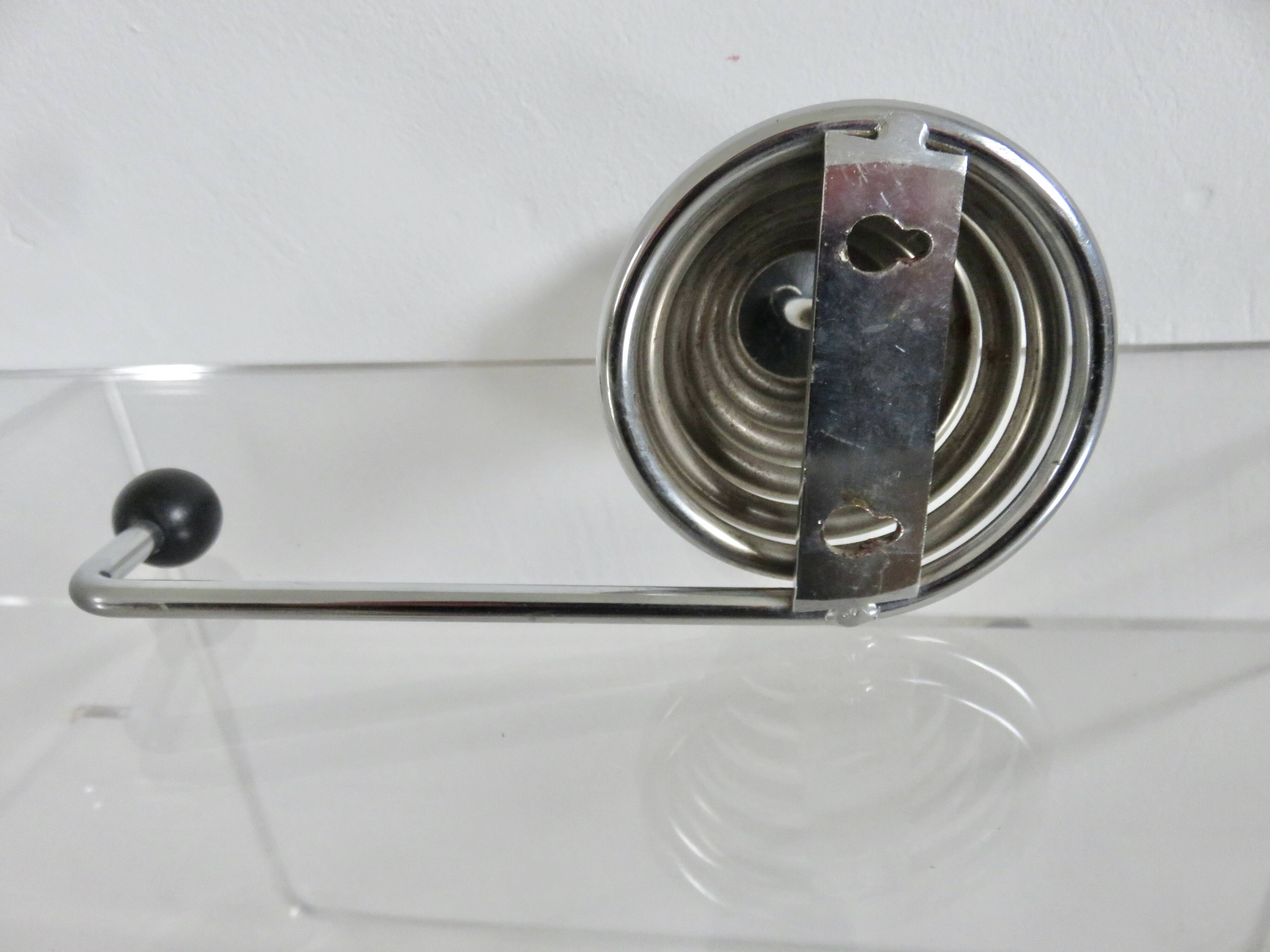 "Streamline" wall coat rack in chromed metal and black lacquered wood, 1970.