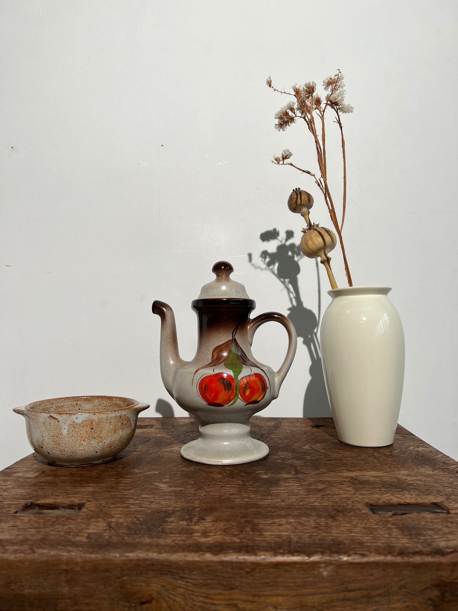 Vintage stoneware teapot with flower and fruit patterns
