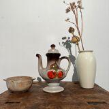 Vintage stoneware teapot with flower and fruit patterns