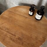 Round coffee table made of solid wood in orange color (soft color)
