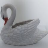 ceramic pot cover in the shape of a swan