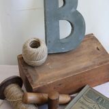 Letter of sign in zinc