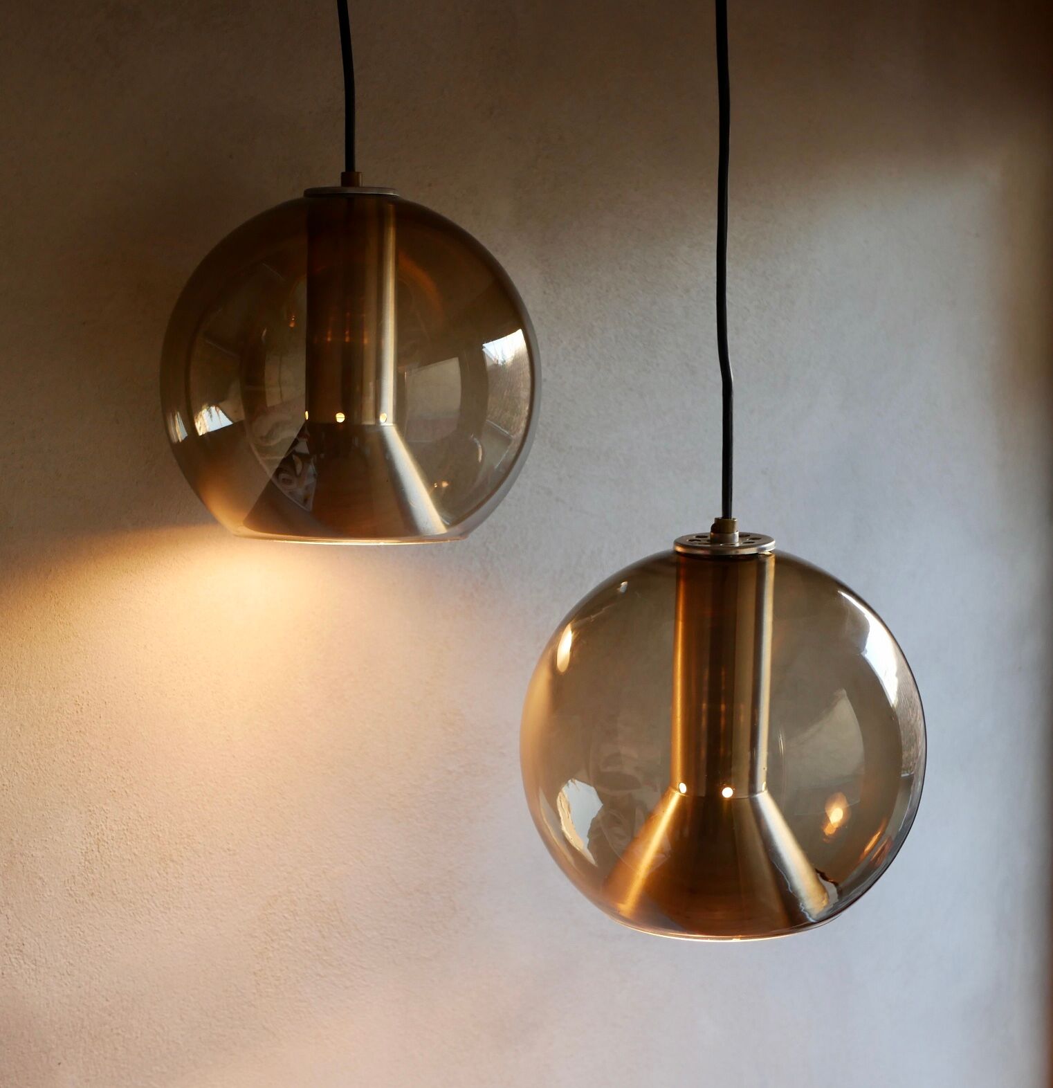 Pair of raak Amsterdam globe suspensions