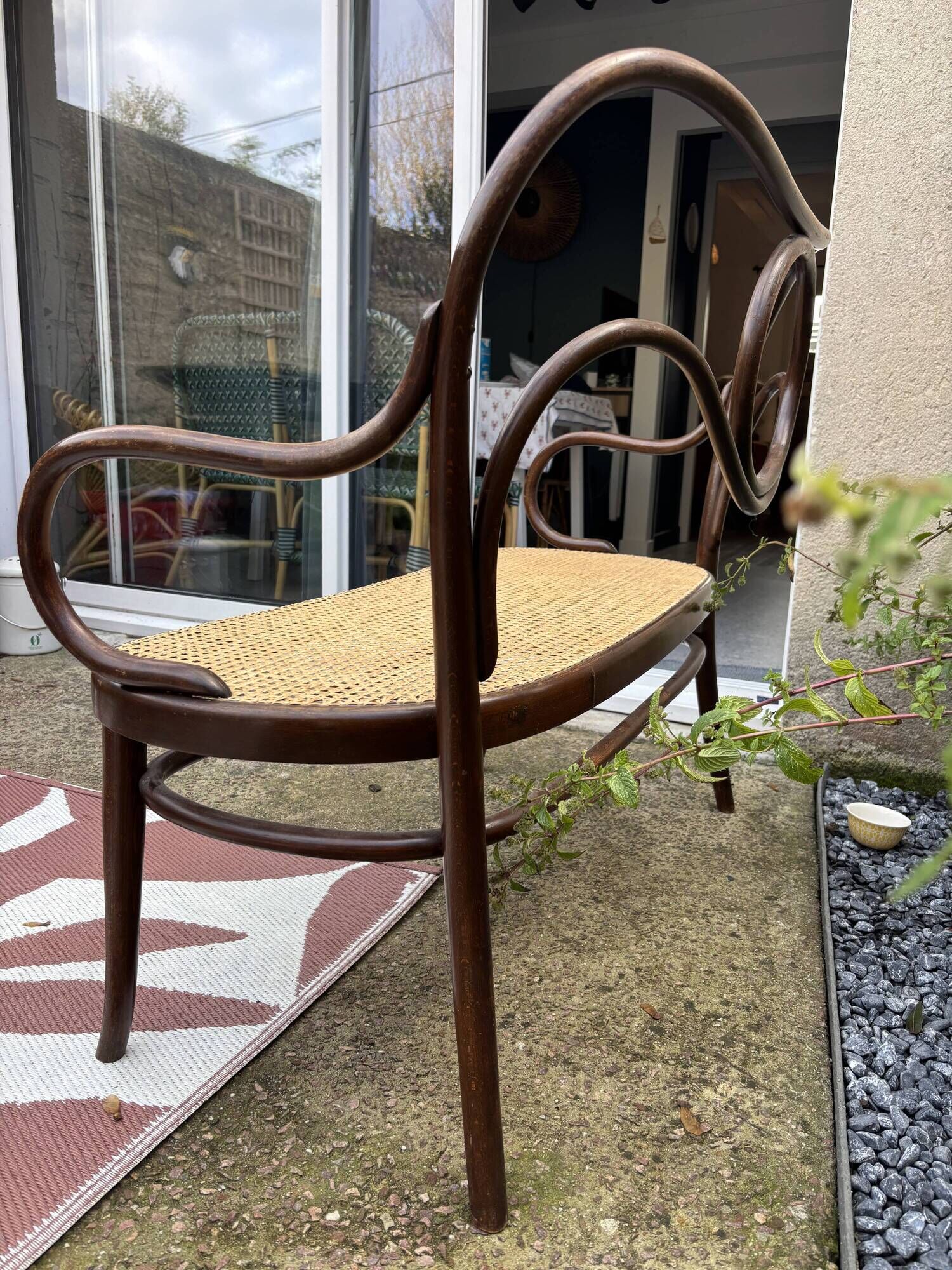 Antique Thonet bench in bent wood and caning, signed.
