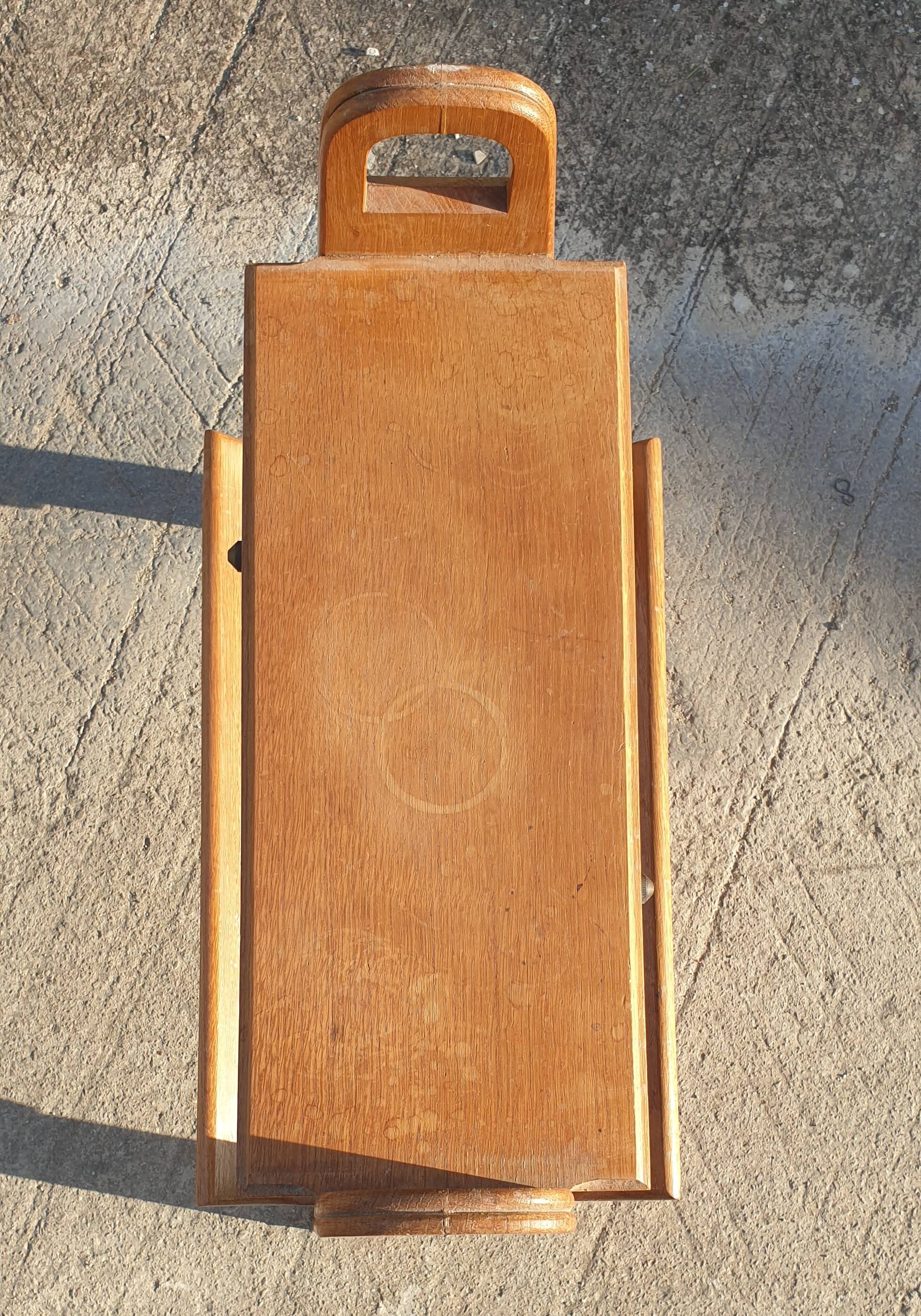 Magazine rack with sliding drawers in light wood, Scandinavian style.