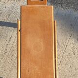 Magazine rack with sliding drawers in light wood, Scandinavian style.