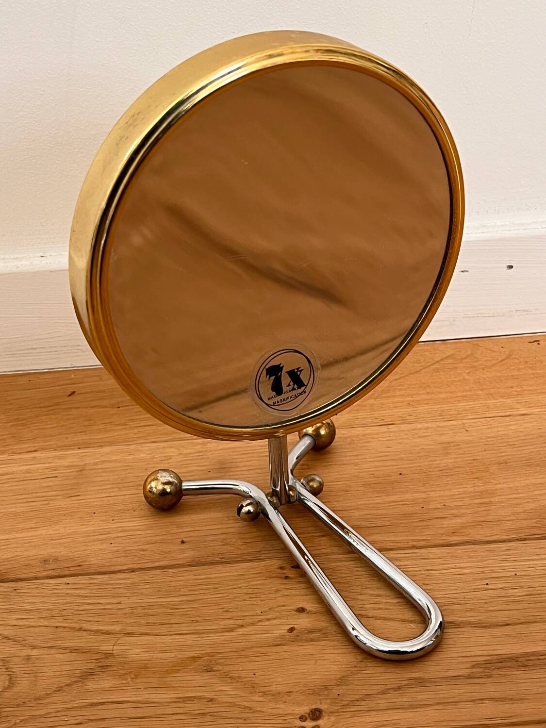 Magnifying brass mirror