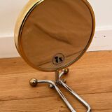 Magnifying brass mirror