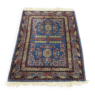 Small handmade wool Iranian rug.