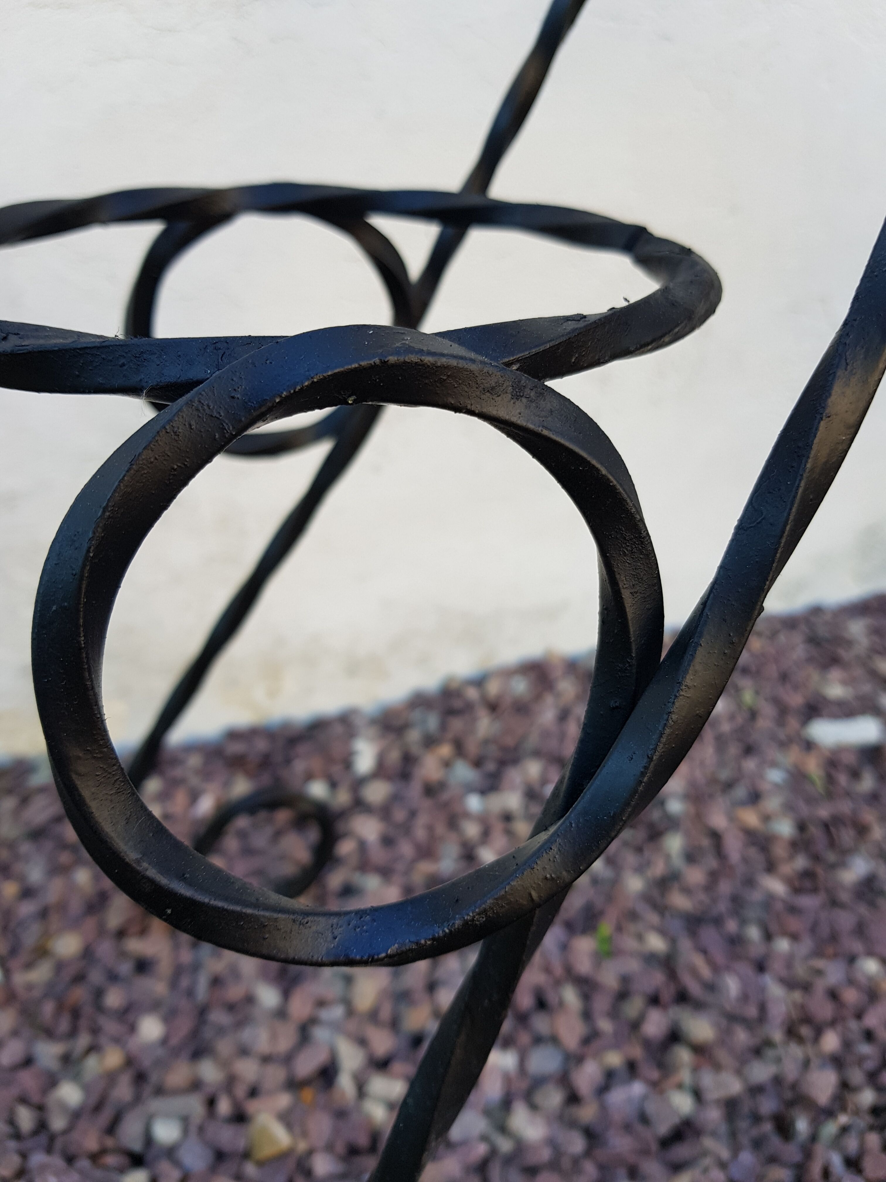 Black wrought iron plant holder