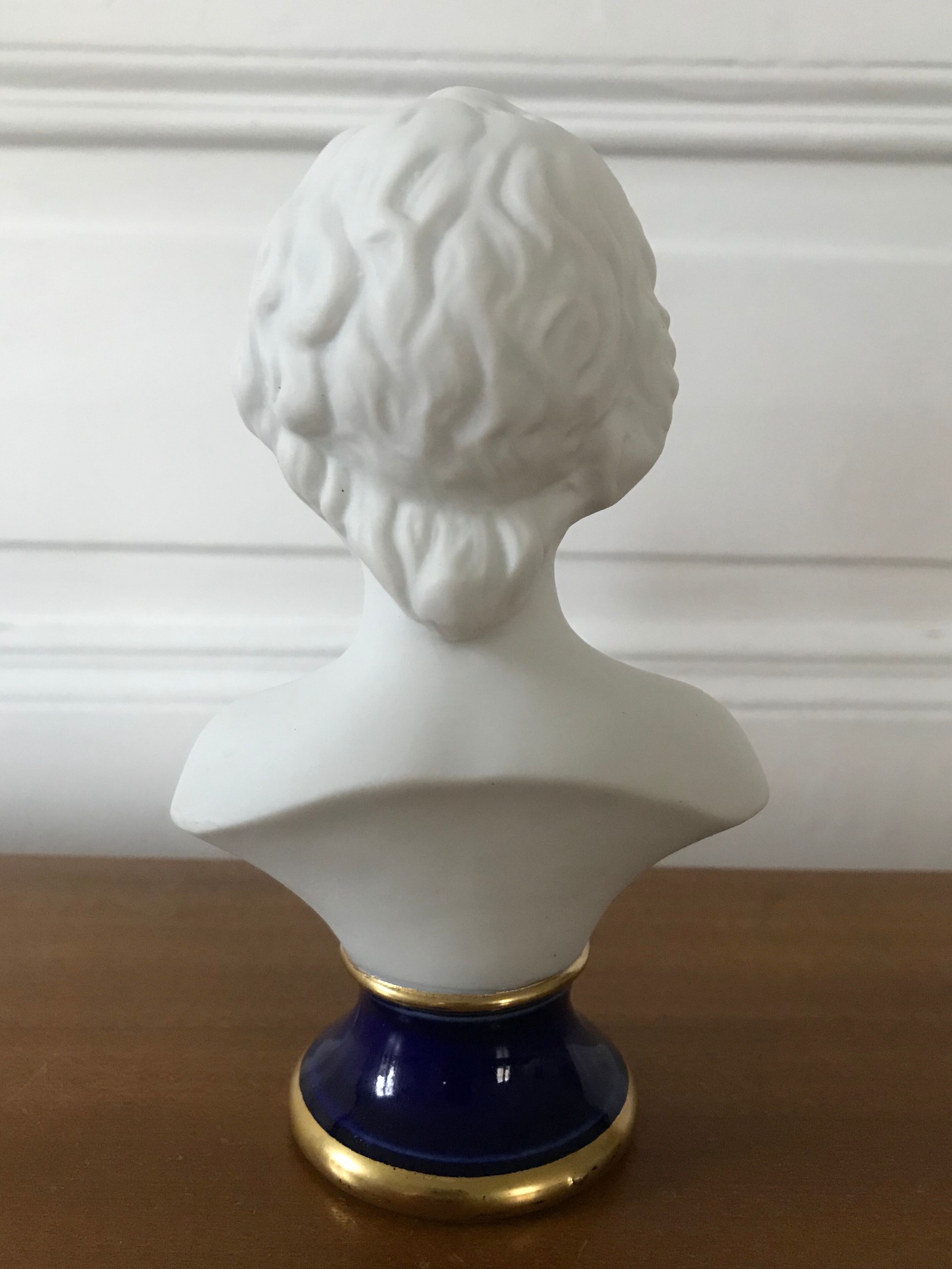 Ancient statuette bust in biscuit