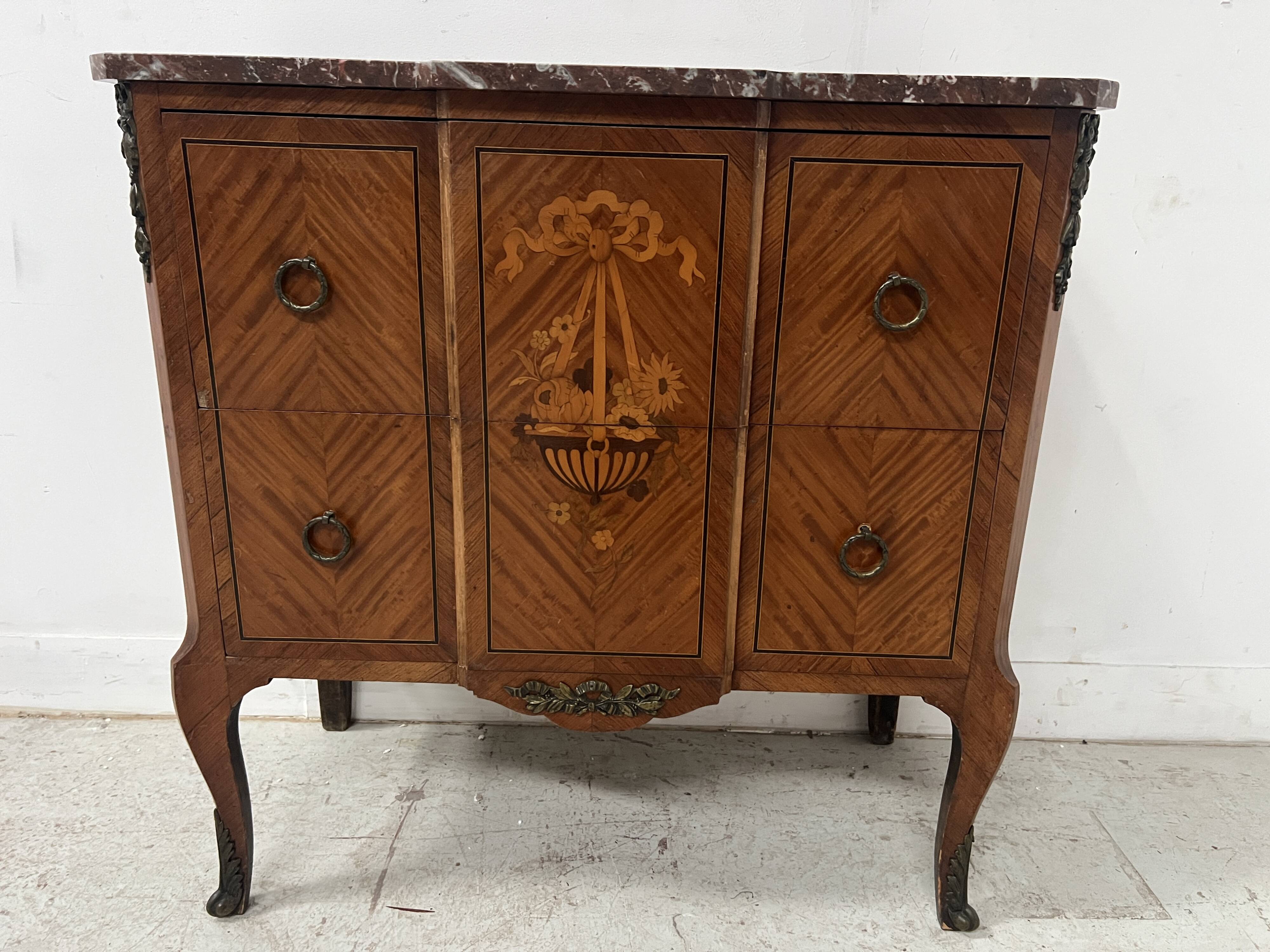 Transitional style commode with a protruding front, in marquetry wood, 20th century.