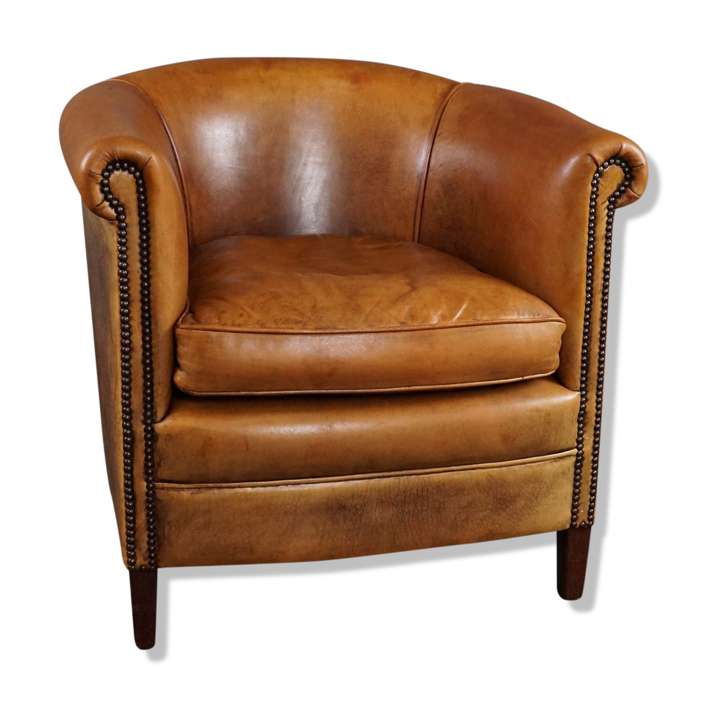 Club armchair in cognac-colored sheepskin
