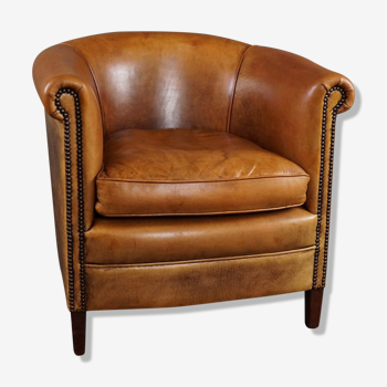 Club armchair in cognac-colored sheepskin