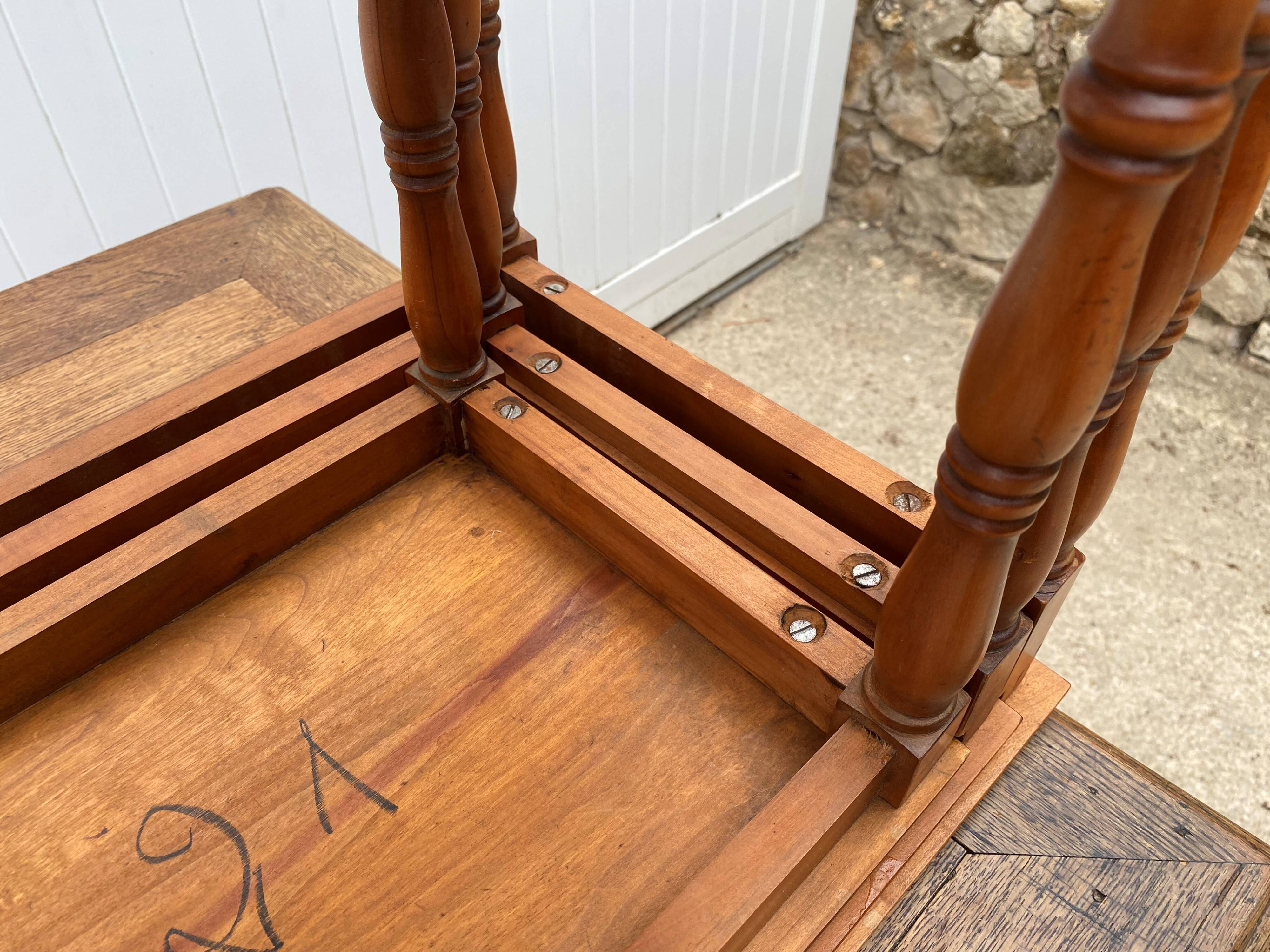 Set of 3 rustic cherry wood nesting coffee tables from the 1950s.