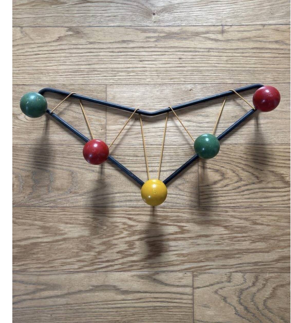 Vintage coat rack in the style of Roger Ferraud.