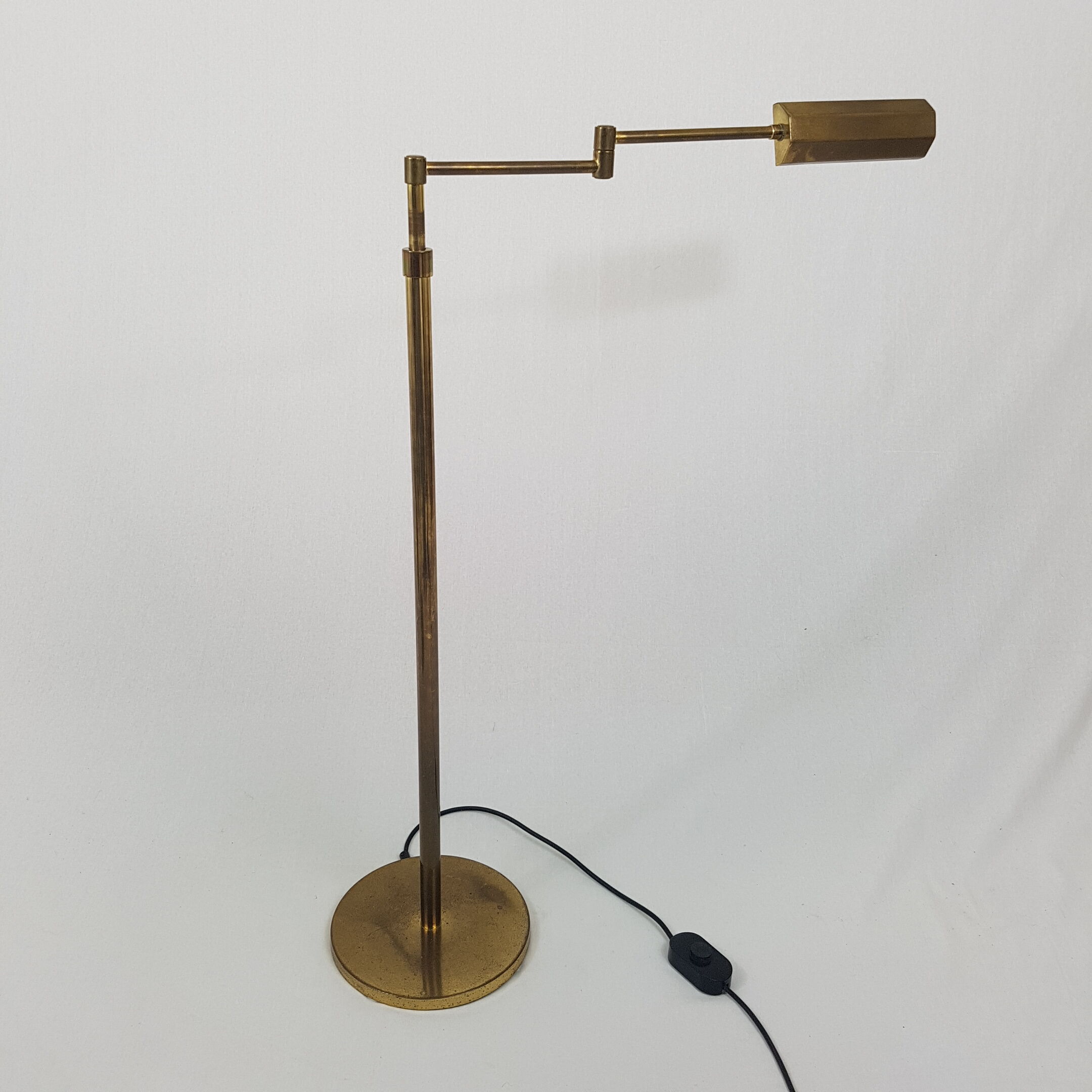 Articulated brass floor lamp