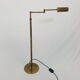 Articulated brass floor lamp