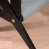 Vintage armchair from the 1960s in black wood and fabric.