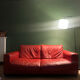 Red leather 2/3-seater sofa by Roche Bobois