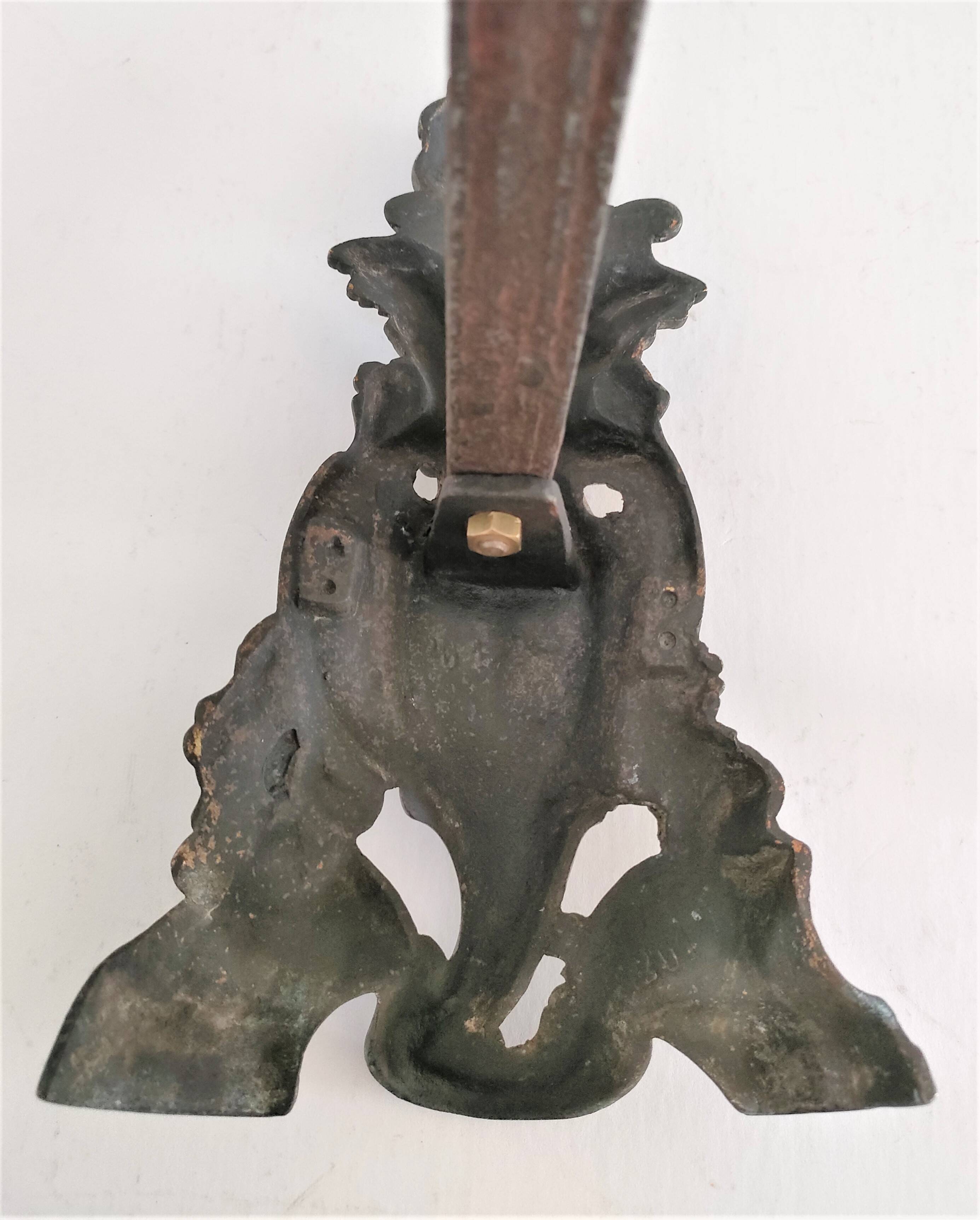 Pair of bronze andirons with black patina, 19th century, female caryatids