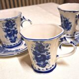 Three cups and two saucers made of Gzhel porcelain.