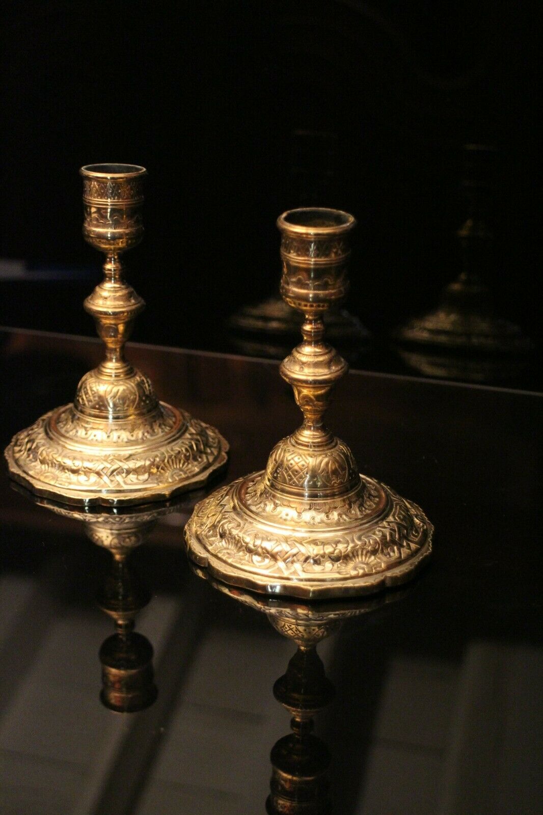 Pair of 19th bronze candlesticks with Regency-style chiseled decoration