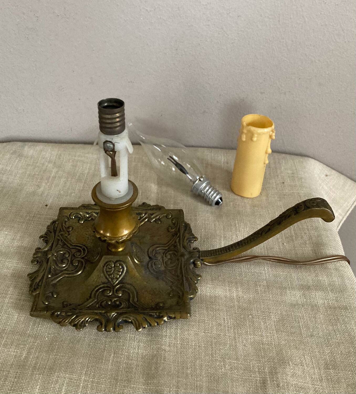 Candle holder with 20th century spelter socket mounted as a flame bulb lamp