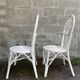 Pair of white peacock rattan chairs, circa 1960