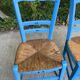 2 solid wood chairs in blue straw
