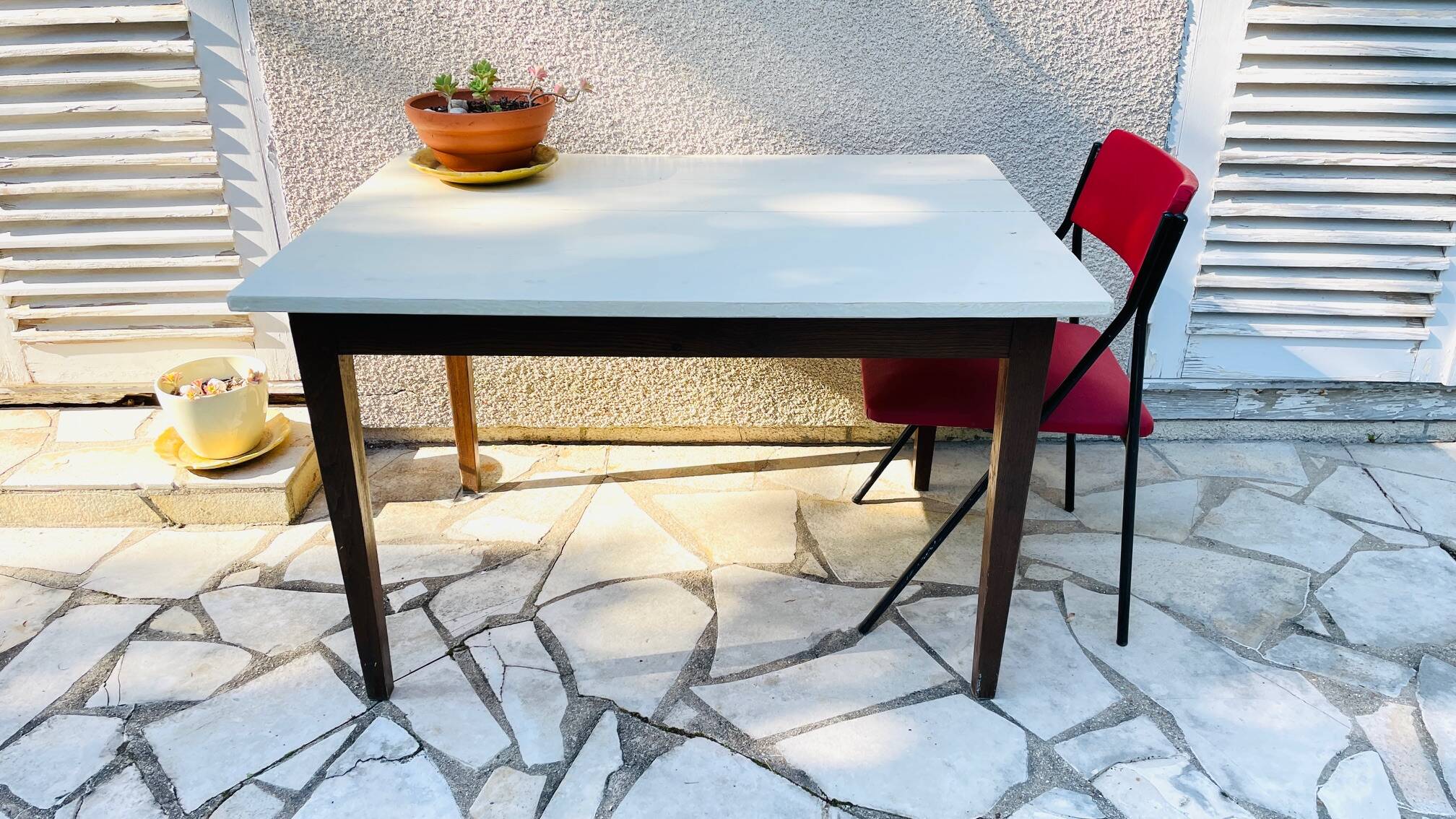 Vintage oak farmhouse table with a white top.