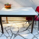 Vintage oak farmhouse table with a white top.
