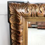 Gold-tinted wooden and stucco rectangular mirror - 1920