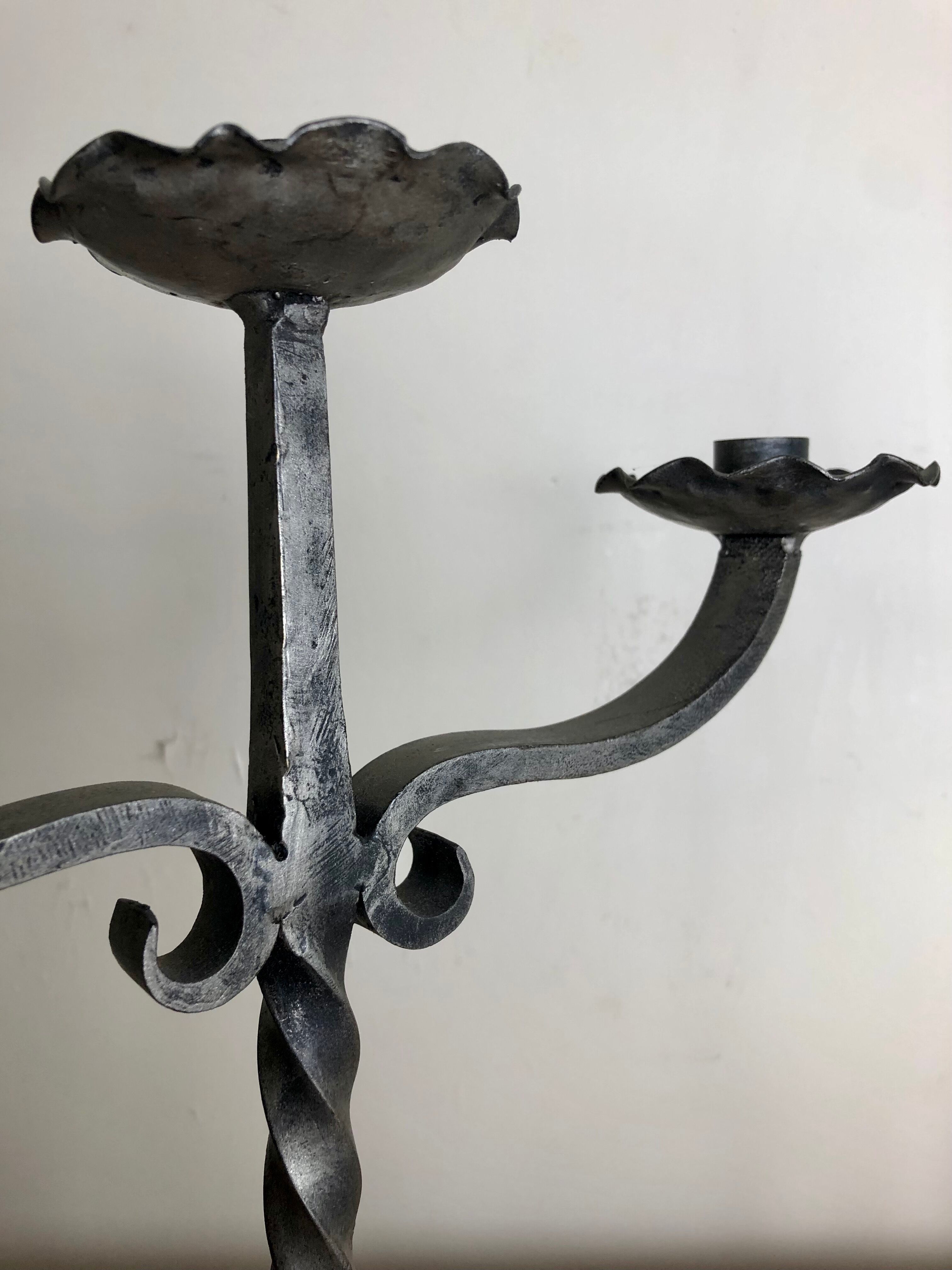 Pair of wrought iron candlesticks