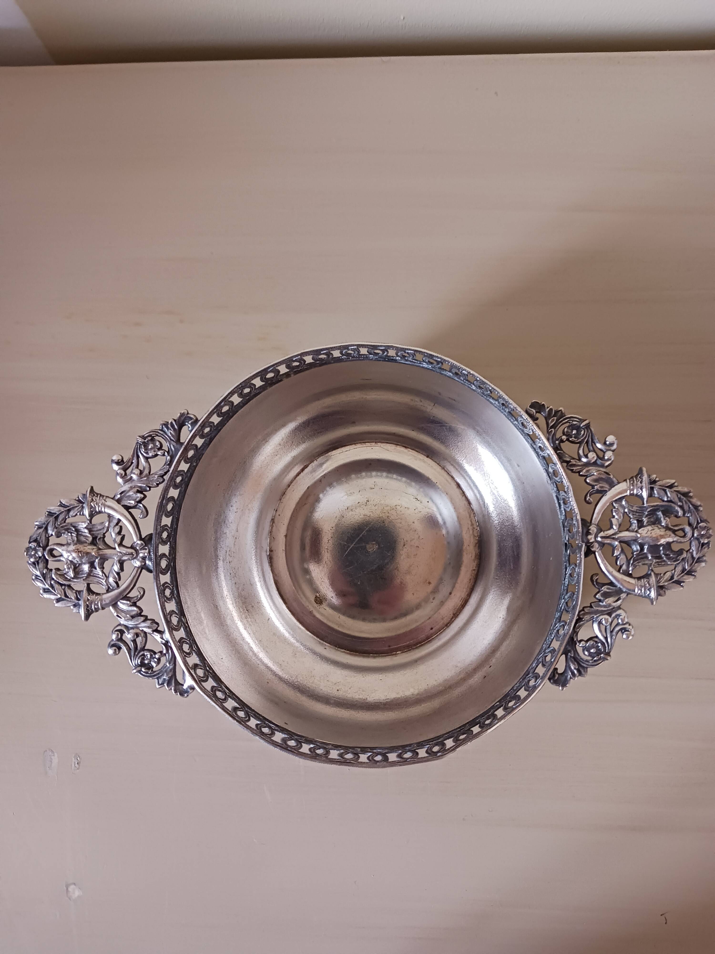 Chiseled silver-plated metal cup.