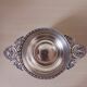 Chiseled silver-plated metal cup.