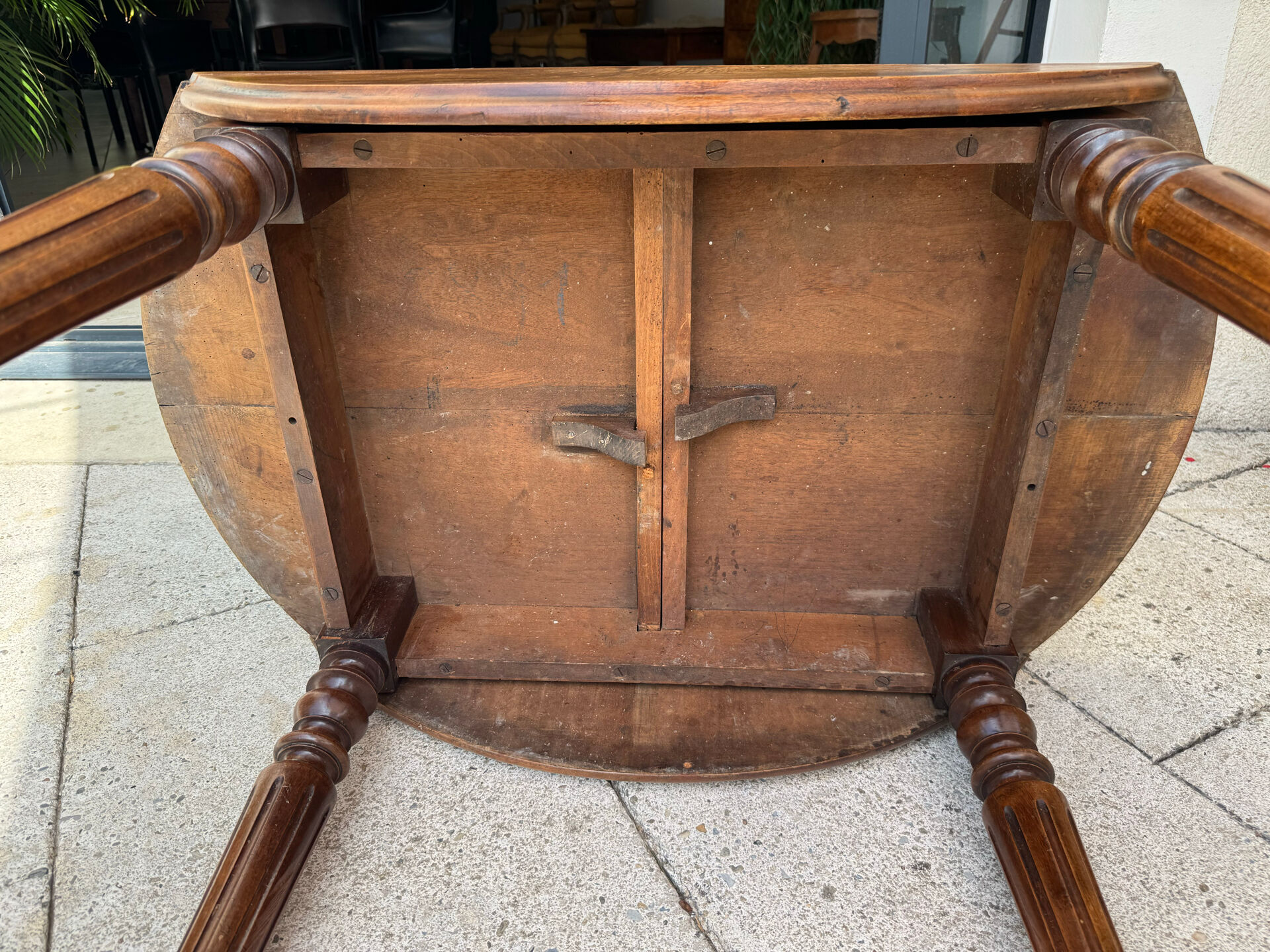 Farm table, two drop-leaves, 19th century, solid walnut.