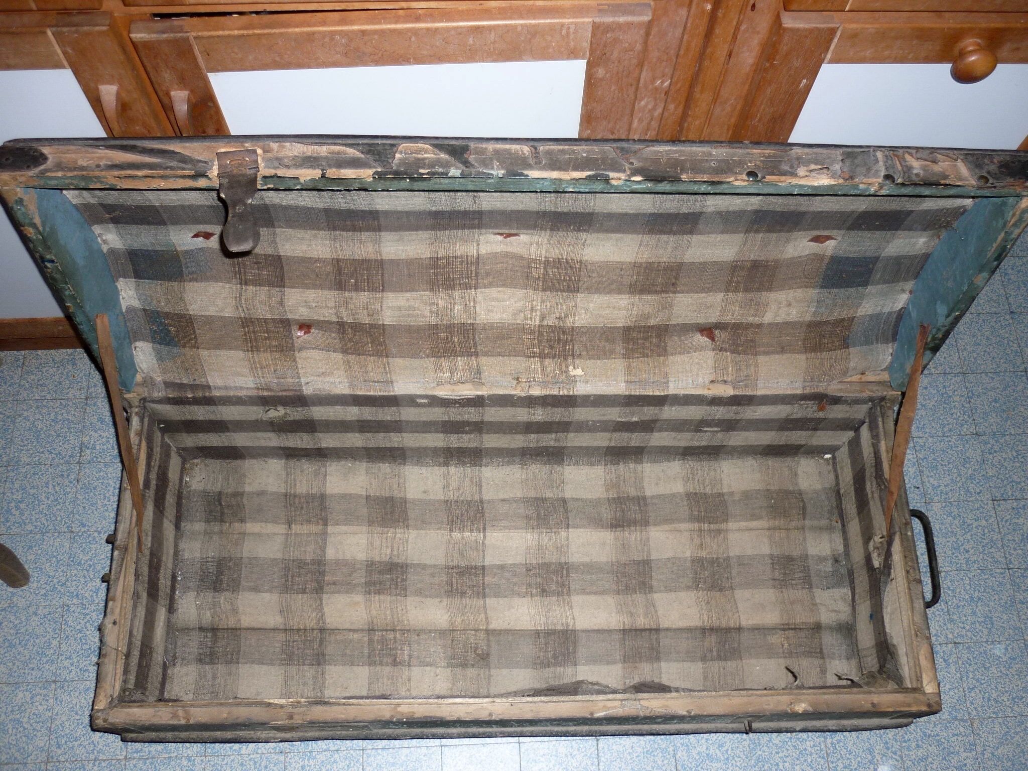 Old bulging wooden travel trunk