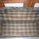 Old bulging wooden travel trunk