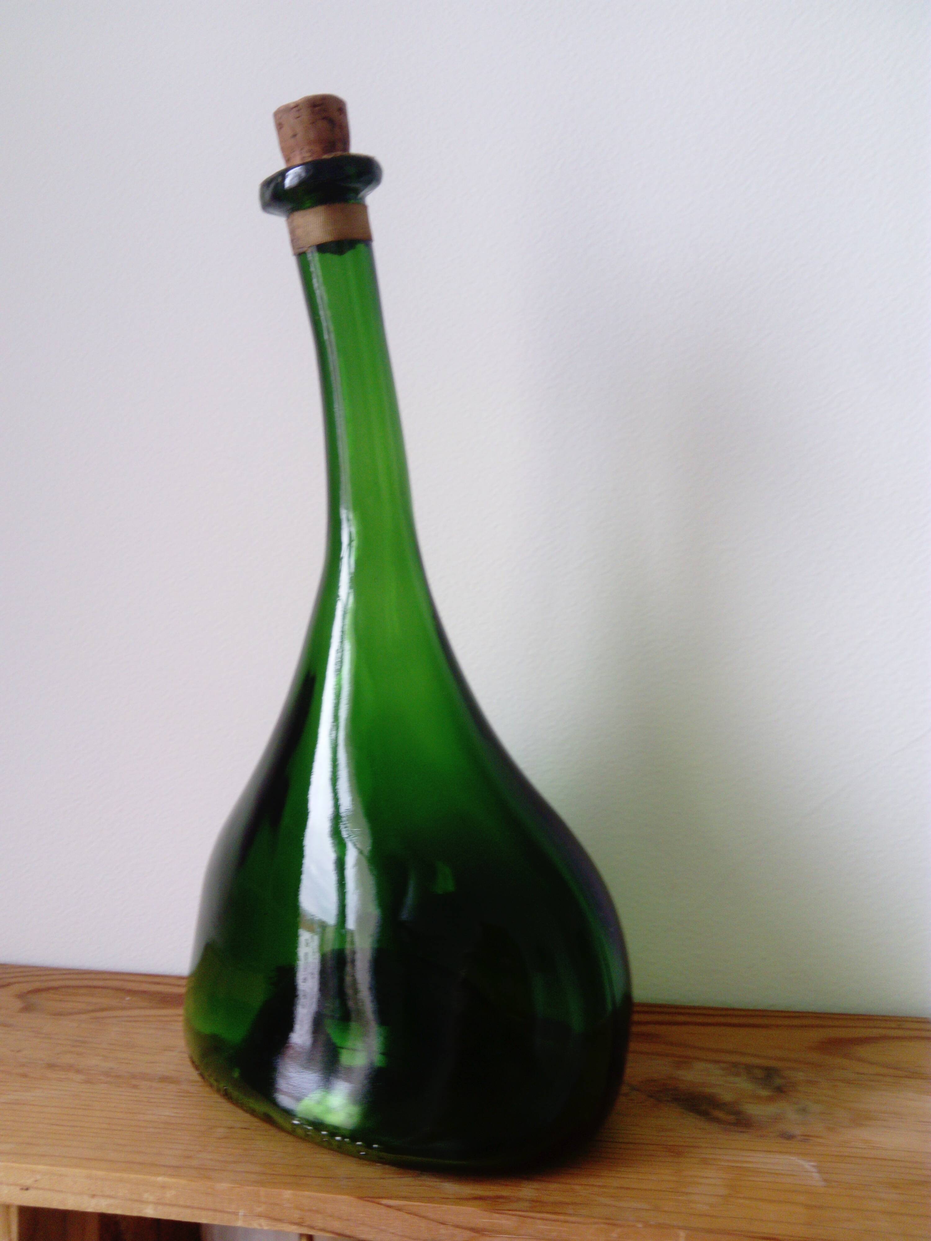 Old blown glass bottle, free form. Armagnac