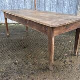 Antique farmhouse table in solid oak with tapered legs and 1 drawer at the end.