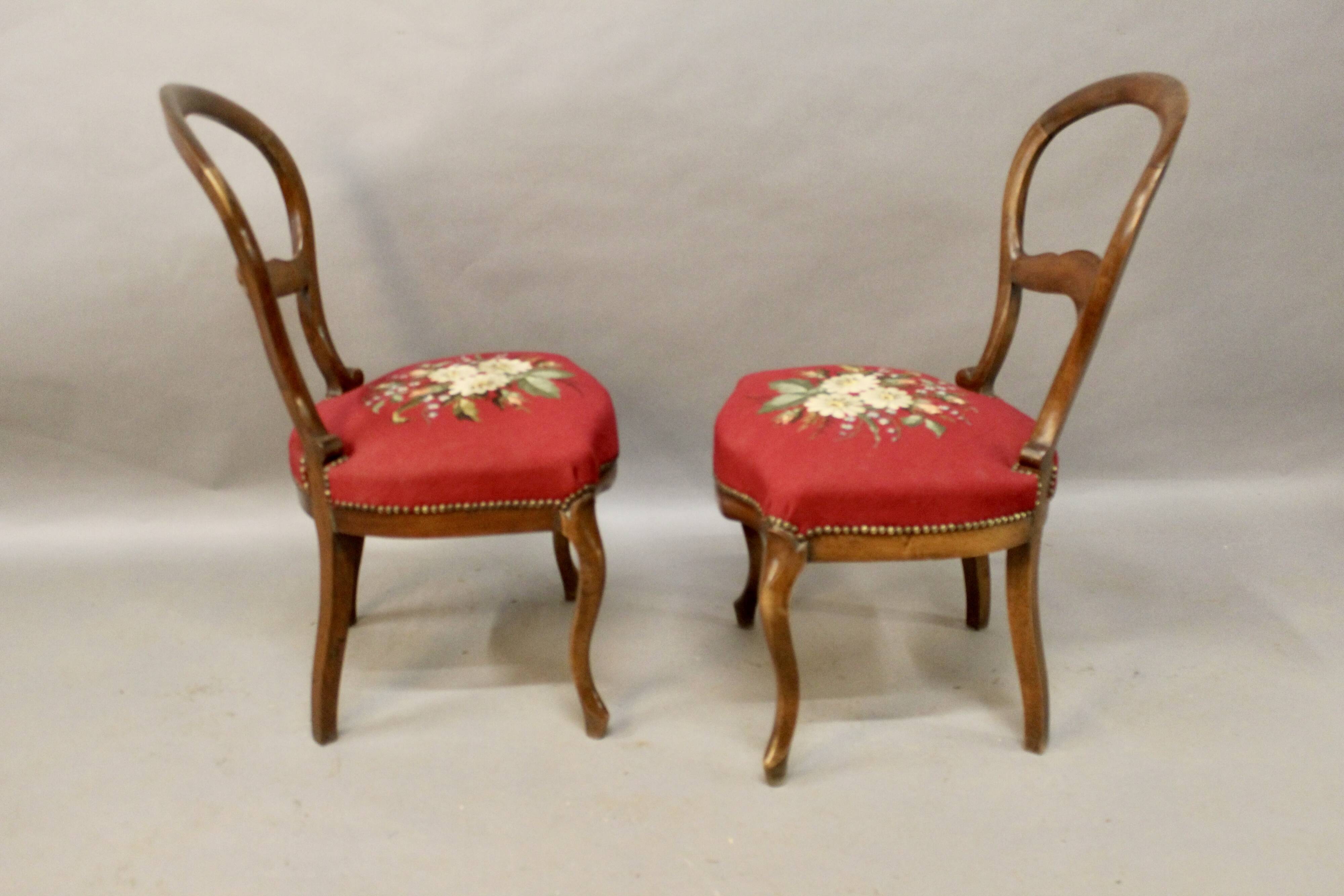 Pair of Louis Philippe walnut chairs, petit point tapestry