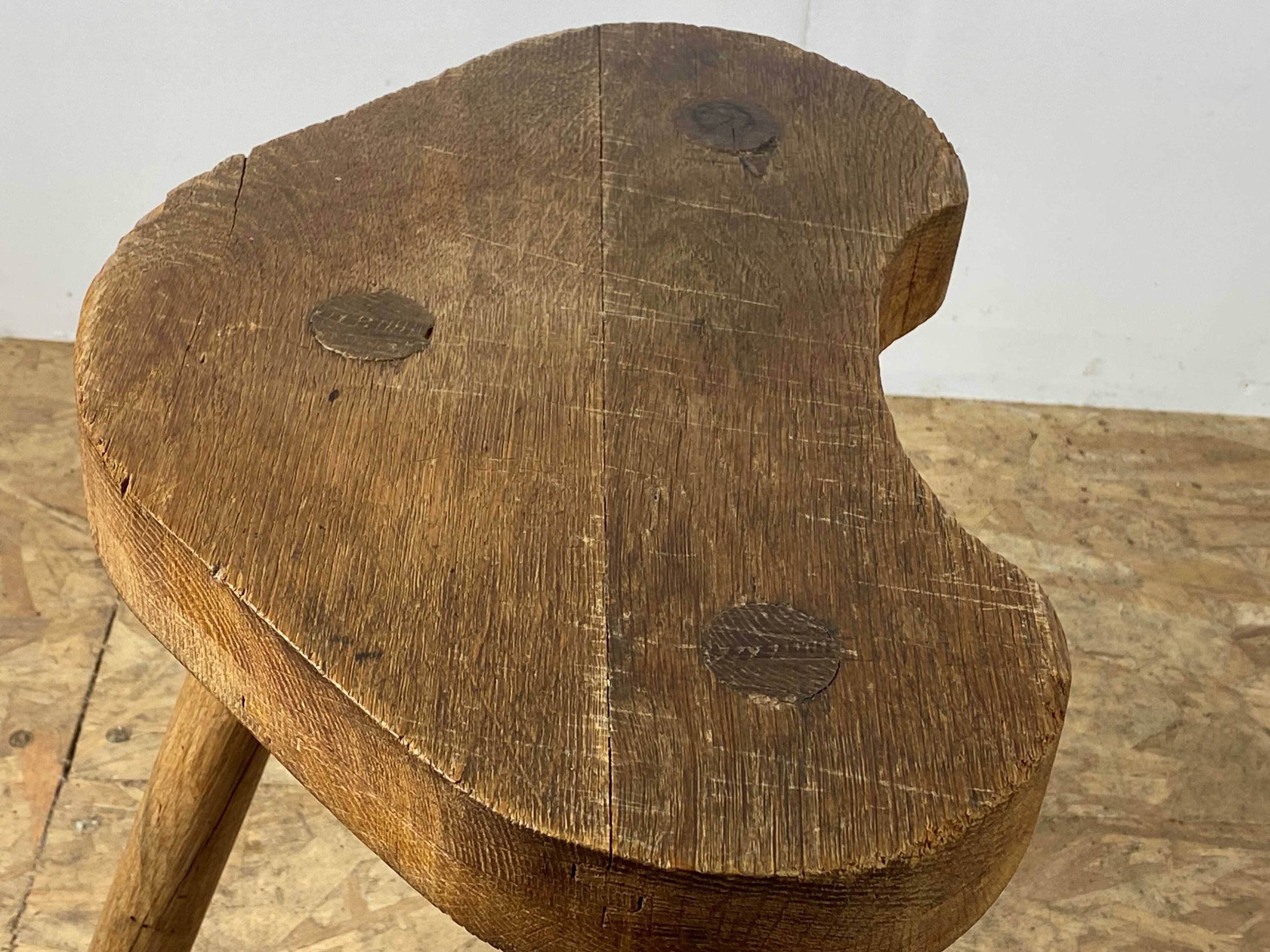 Set of 6 brutalist solid oak tripod farm stools from the 1950s
