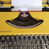 Vintage yellow portable typewriter, functional, AEG, new ribbon