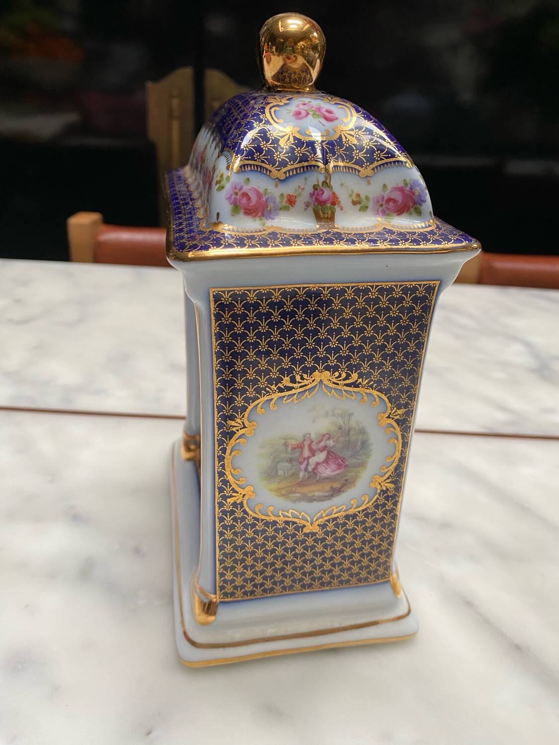 English porcelain clock and candle holders