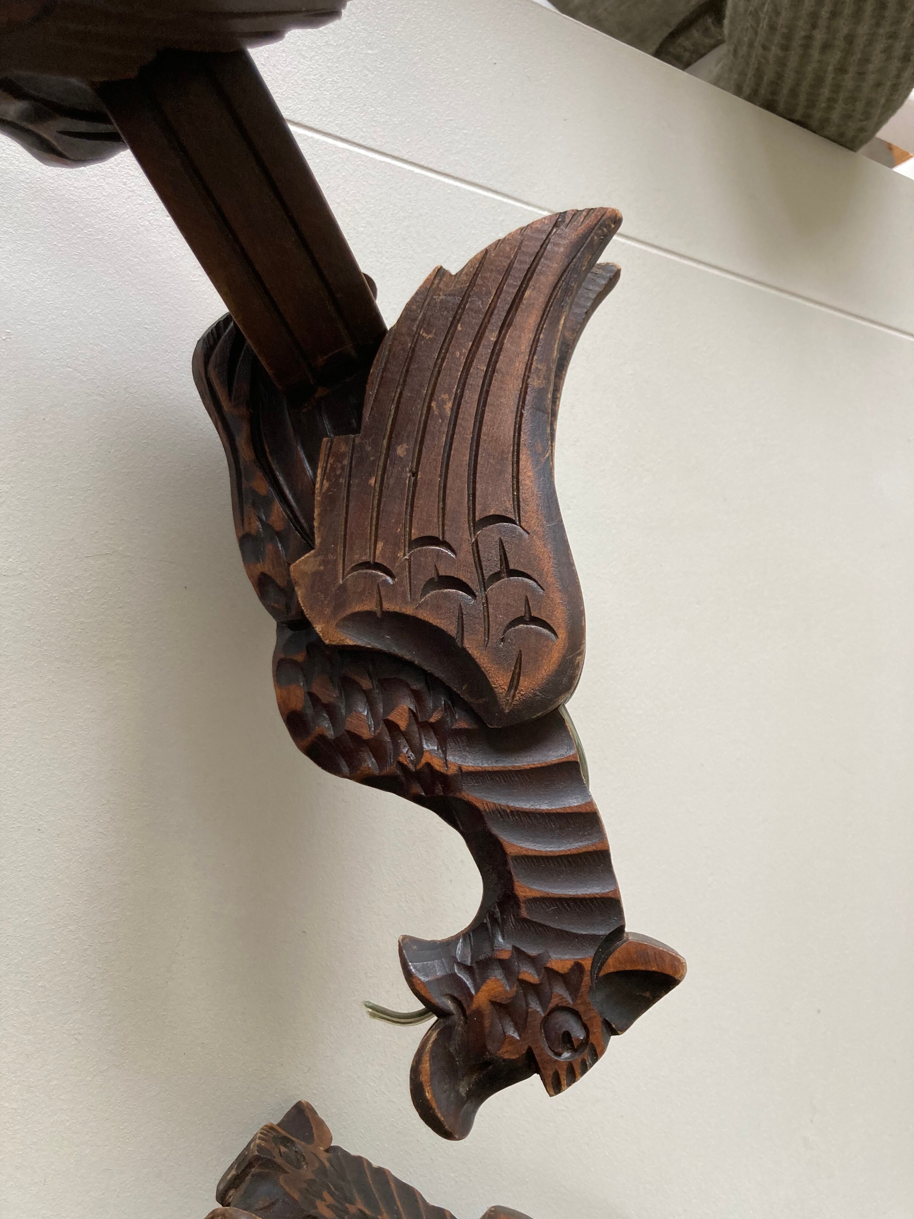 Pair of winged dragon sconces in carved wood