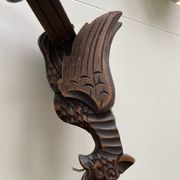 Pair of winged dragon sconces in carved wood